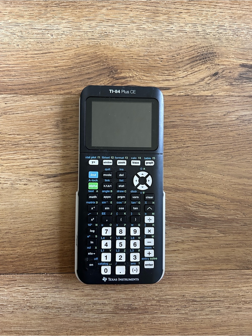 TI-84 Plus CE Graphing Calculator with wire to charge